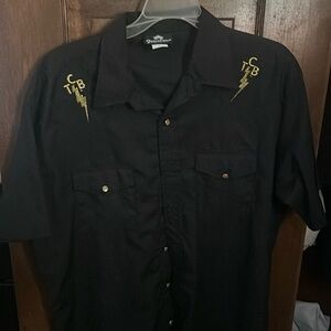 Elvis “TCB” short sleeve pearl buttoned shirt.